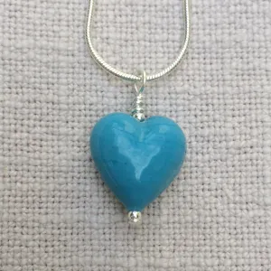 Necklace with turquoise (blue) pastel Murano glass small heart pendant on silver snake chain